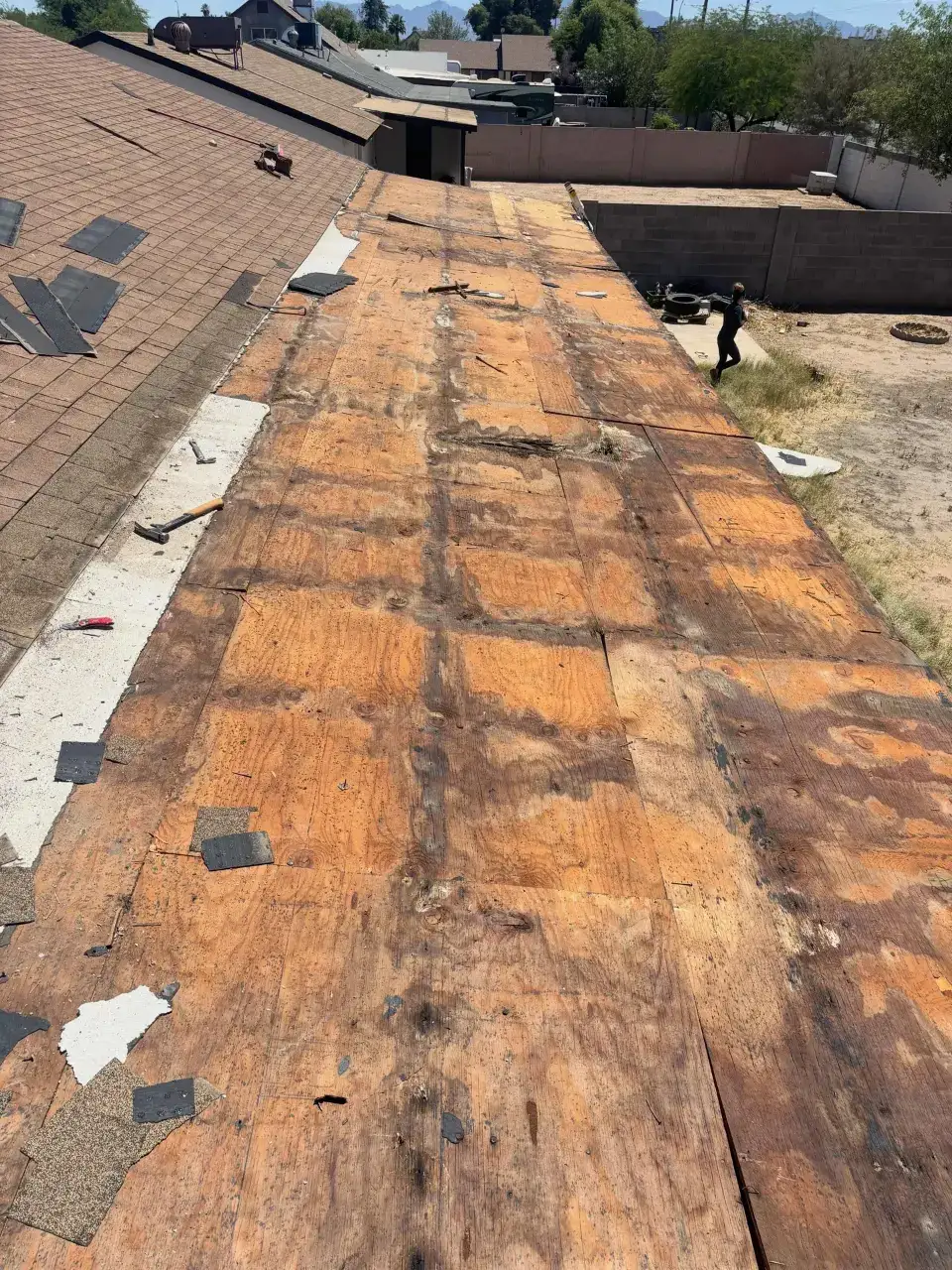 Flat roof torn off to the decking with new plywood sections installed